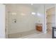 Glass shower features large tile and built in shelves at 18169 W Cactus Flower W Dr, Goodyear, AZ 85338