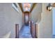 Charming entrance featuring a secure gate and well-lit walkway leading to the inviting front door at 18169 W Cactus Flower W Dr, Goodyear, AZ 85338