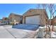 Spacious two-car garage of a single-story home with a well-kept yard and charming exterior details at 18169 W Cactus Flower W Dr, Goodyear, AZ 85338