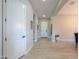 Bright hallway featuring tile floors and neutral color palette at 18169 W Cactus Flower W Dr, Goodyear, AZ 85338