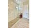 Spacious walk-in shower with frameless glass enclosure and marble tile at 18169 W Cactus Flower W Dr, Goodyear, AZ 85338