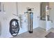 Utility room with water heater and water treatment systems at 18169 W Cactus Flower W Dr, Goodyear, AZ 85338