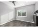 Well-lit bedroom featuring a window with blinds and gray flooring at 1825 W Ray Rd # 2060, Chandler, AZ 85224