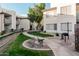 Landscaped community grounds with a walking path and bench at 1825 W Ray Rd # 2060, Chandler, AZ 85224