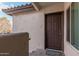 Exterior entryway with a dark brown door and welcome mat at 1825 W Ray Rd # 2060, Chandler, AZ 85224