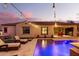 Night view of backyard pool and patio area at 20404 W Crescent Dr, Buckeye, AZ 85396