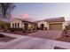 House exterior view from the street at dusk at 20404 W Crescent Dr, Buckeye, AZ 85396