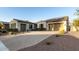 Beautiful home exterior with solar panels and landscaping at 20404 W Crescent Dr, Buckeye, AZ 85396