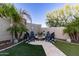 Landscaped backyard with fire pit and seating area at 20404 W Crescent Dr, Buckeye, AZ 85396