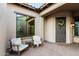 Inviting front porch with seating and charming wreath at 20404 W Crescent Dr, Buckeye, AZ 85396