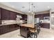 Gourmet kitchen with granite island and stainless steel appliances at 20404 W Crescent Dr, Buckeye, AZ 85396