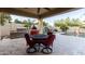 Covered patio with dining area and built-in grill at 20404 W Crescent Dr, Buckeye, AZ 85396