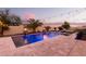 Relaxing pool area with string lights at dusk at 20404 W Crescent Dr, Buckeye, AZ 85396