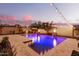 Stunning nighttime view of a pool with lighting at 20404 W Crescent Dr, Buckeye, AZ 85396