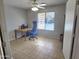 Bright home office features a desk, chair, and window with blinds at 2101 S Meridian Rd # 274, Apache Junction, AZ 85120