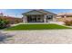 Cozy backyard with artificial turf, desert landscaping and a covered patio at 2837 W Minton St, Phoenix, AZ 85041