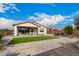 Spacious backyard featuring a patio, artificial grass, and a gravel landscape, perfect for outdoor activities at 2837 W Minton St, Phoenix, AZ 85041
