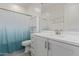 Bright bathroom featuring a toilet and vanity with framed mirror at 2837 W Minton St, Phoenix, AZ 85041