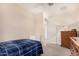 Comfortable bedroom with a wooden dresser, neutral walls, and lots of natural light at 2837 W Minton St, Phoenix, AZ 85041
