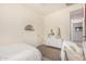 Bright bedroom with a cozy bed, a decorative mirror, and a modern dresser at 2837 W Minton St, Phoenix, AZ 85041
