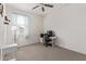 Bedroom with a ceiling fan, window, and neutral colored carpet at 2837 W Minton St, Phoenix, AZ 85041