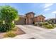 Single story home with stone exterior, landscaping, and two-car garage at 2837 W Minton St, Phoenix, AZ 85041