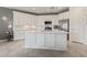 Bright kitchen features white cabinets, stainless steel appliances, and a large center island at 2837 W Minton St, Phoenix, AZ 85041
