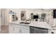 Modern kitchen with stainless steel appliances, an island with a sink and seating at 2837 W Minton St, Phoenix, AZ 85041