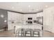 Spacious kitchen featuring white cabinets, a large island, and stainless steel appliances at 2837 W Minton St, Phoenix, AZ 85041