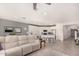 Bright living room with beige couch, large windows, and an open floor plan at 2837 W Minton St, Phoenix, AZ 85041