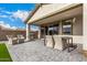Covered patio with outdoor seating, a grill, and a view of the landscaped backyard at 2837 W Minton St, Phoenix, AZ 85041