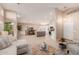 Bright living room with neutral décor, an open floor plan, a ceiling fan, and light hardwood floors at 3721 N 150Th Ct, Goodyear, AZ 85395