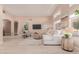 Comfortable living room with a large sectional sofa, area rug, and views of the outdoor living space at 3721 N 150Th Ct, Goodyear, AZ 85395