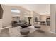 Bright living room featuring vaulted ceilings, clerestory windows, modern decor, and sliding glass doors to the outdoor patio at 3721 N 150Th Ct, Goodyear, AZ 85395