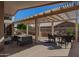 Covered patio featuring dining and lounge furniture, perfect for entertaining at 3721 N 150Th Ct, Goodyear, AZ 85395