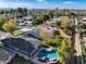 Aerial view showcasing home's backyard pool and neighborhood setting at 4034 E Osborn Rd, Phoenix, AZ 85018