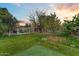 Large backyard with lush lawn and fruit trees at 4034 E Osborn Rd, Phoenix, AZ 85018