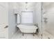 Bathroom with clawfoot tub, chandelier, and walk-in shower at 4034 E Osborn Rd, Phoenix, AZ 85018