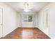 Bright bedroom with wood flooring, ceiling fan, and window coverings at 4034 E Osborn Rd, Phoenix, AZ 85018