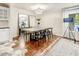 Elegant dining room with hardwood floors and modern light fixture at 4034 E Osborn Rd, Phoenix, AZ 85018