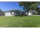 Charming ranch house with a well-manicured lawn at 4034 E Osborn Rd, Phoenix, AZ 85018