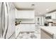 Modern kitchen with white cabinets, stainless steel appliances, and granite countertops at 4034 E Osborn Rd, Phoenix, AZ 85018