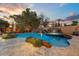 Stunning pool with a waterfall and ample patio space at 4034 E Osborn Rd, Phoenix, AZ 85018