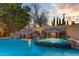 Luxury pool and spa with a waterfall feature at 4034 E Osborn Rd, Phoenix, AZ 85018