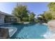 Inviting pool with waterfall feature and spacious deck at 4034 E Osborn Rd, Phoenix, AZ 85018