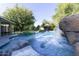 Relaxing pool area with waterfall and rock formations at 4034 E Osborn Rd, Phoenix, AZ 85018