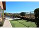 Private backyard with putting green, pool, patio, and mountain views at 6217 E Sienna Bouquet Pl, Cave Creek, AZ 85331