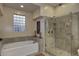 Spa-like bathroom featuring a soaking tub and a separate glass-enclosed shower at 6217 E Sienna Bouquet Pl, Cave Creek, AZ 85331