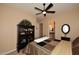 Bright bedroom with a queen bed, ceiling fan, and built-in shelving at 6217 E Sienna Bouquet Pl, Cave Creek, AZ 85331