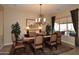 Elegant dining room features a large table, chandelier, and ample natural light at 6217 E Sienna Bouquet Pl, Cave Creek, AZ 85331